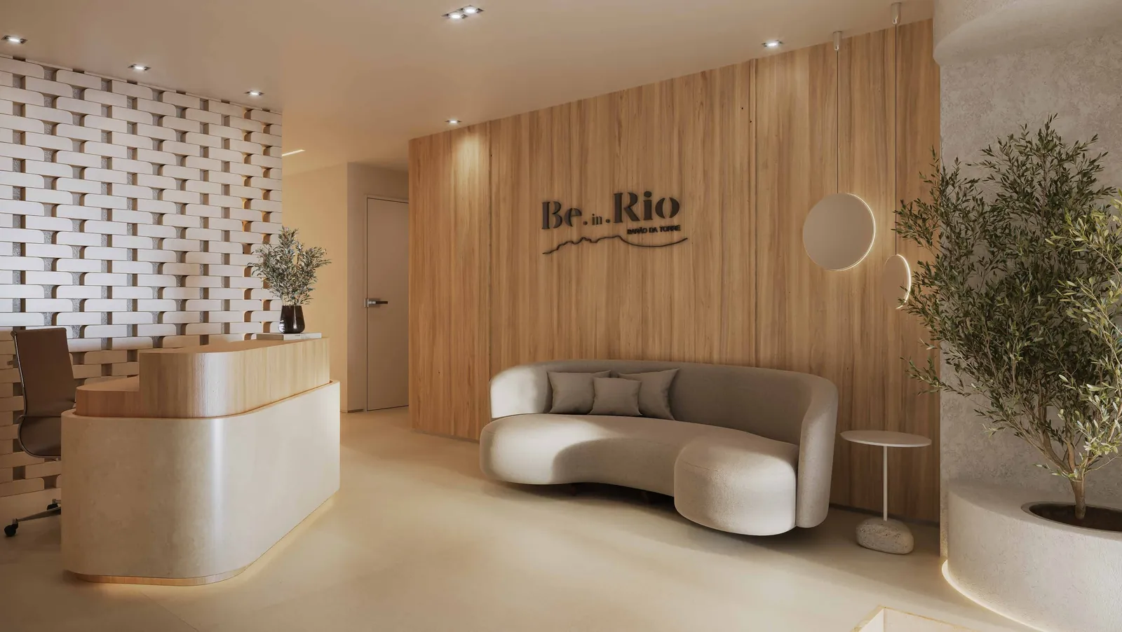 Portaria com balcão, sofá curvo e o logo Be.in.Rio