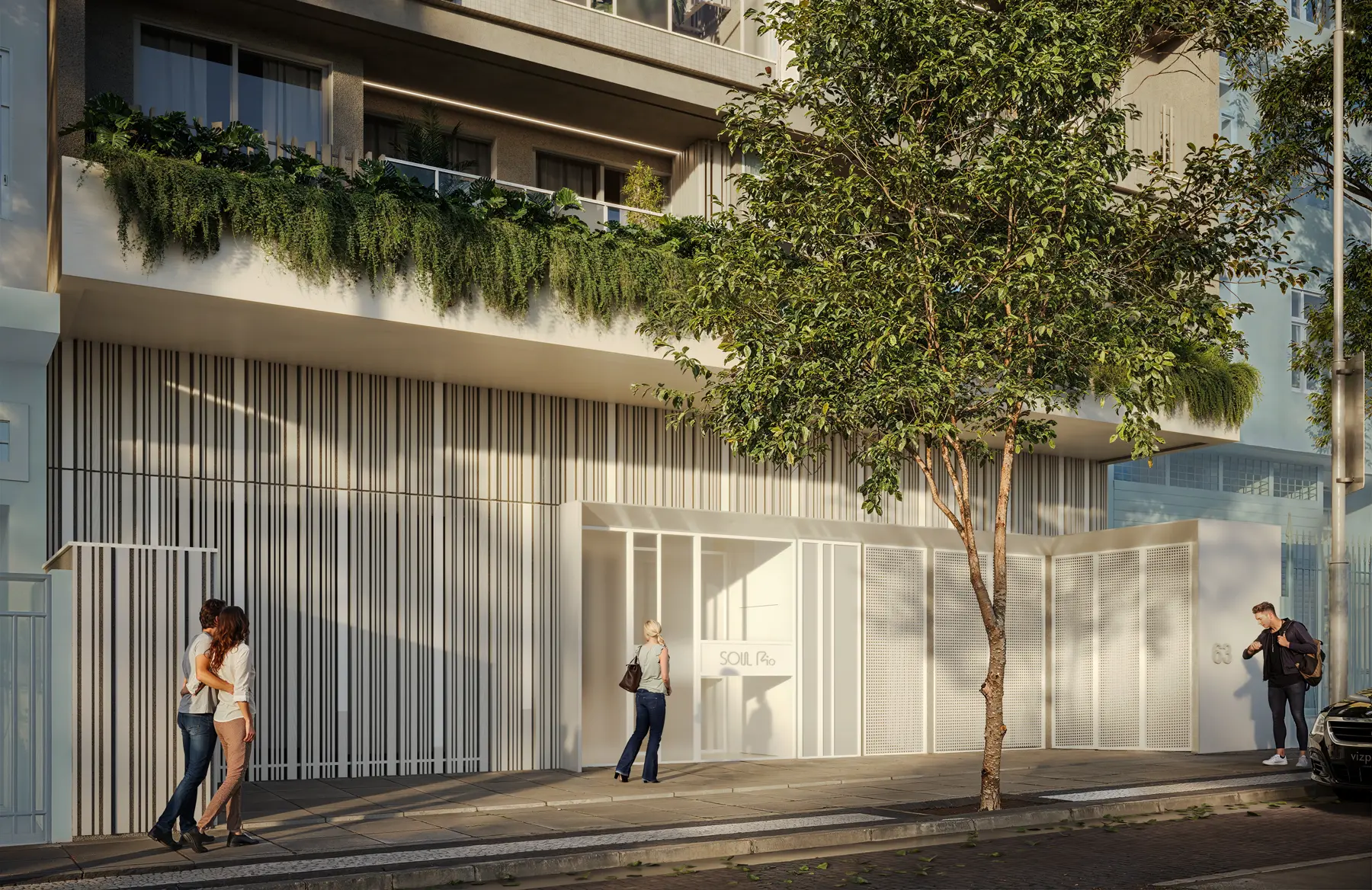 O térreo do prédio, com jardineiras e acesso de vidro