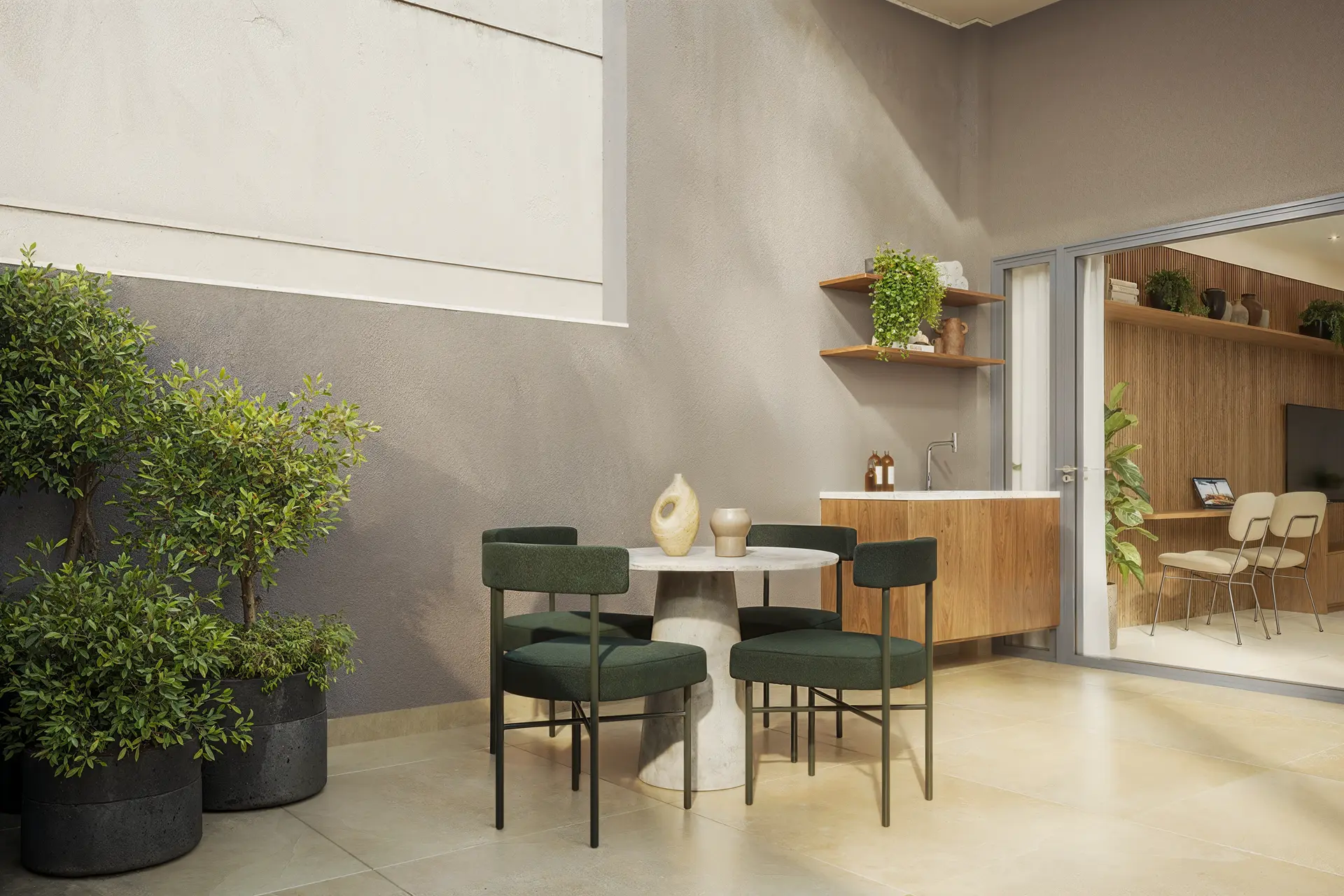 Área externa de um garden com poltronas e plantas